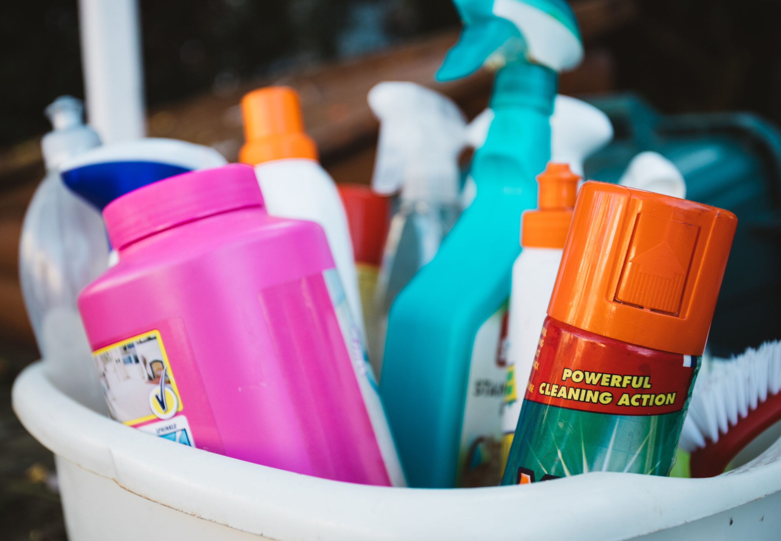 Bucket of cleaning supplies ready for a fall home reset