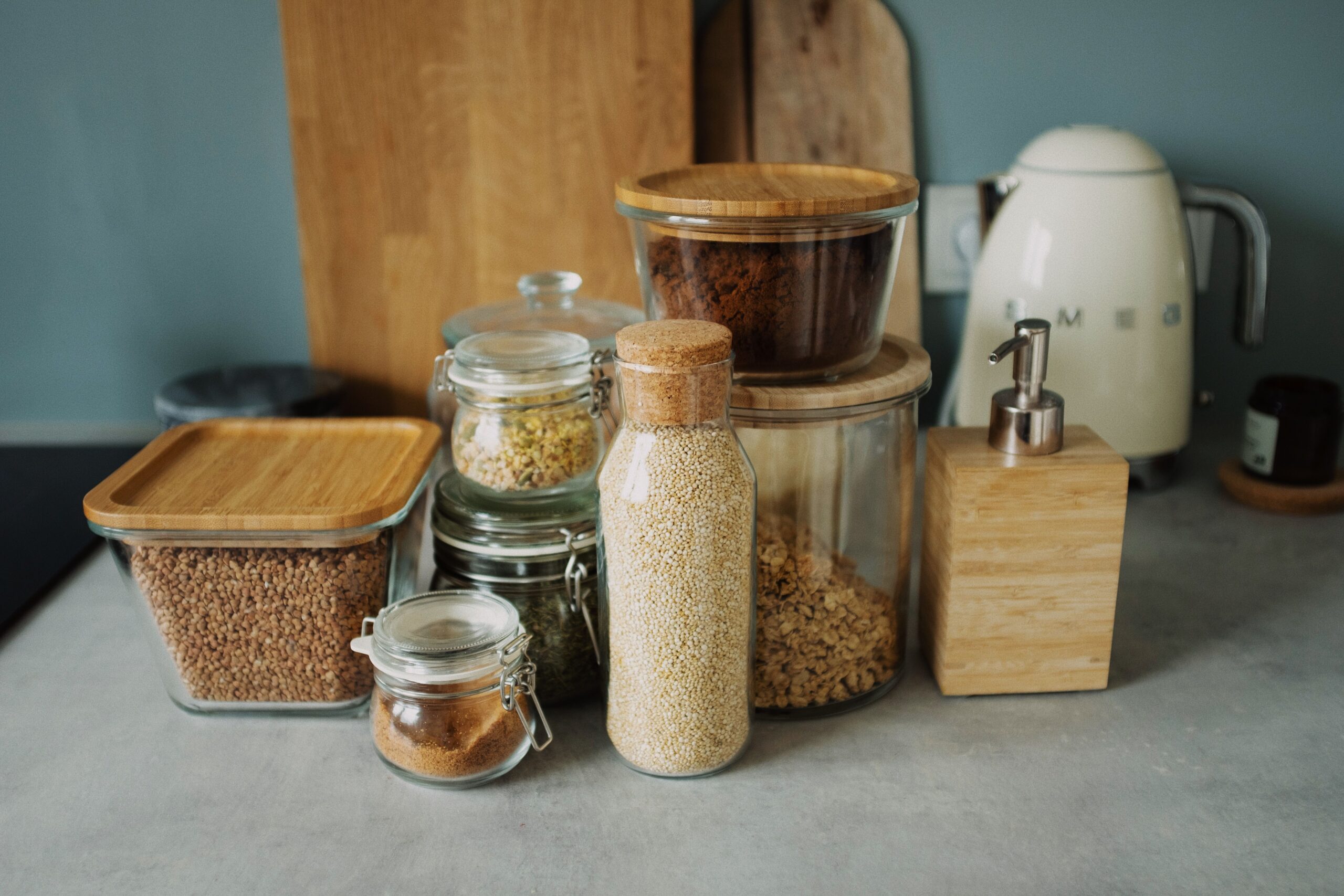 A well stocked pantry with jars of grains, beans and pasta