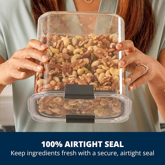Hands holding a Rubbermaid Brilliance airtight canister filled with nuts