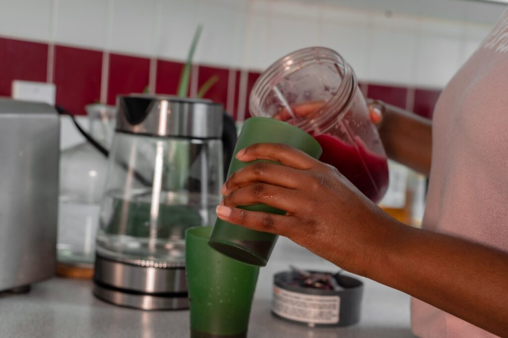 Fruit smoothie being poured into a glass