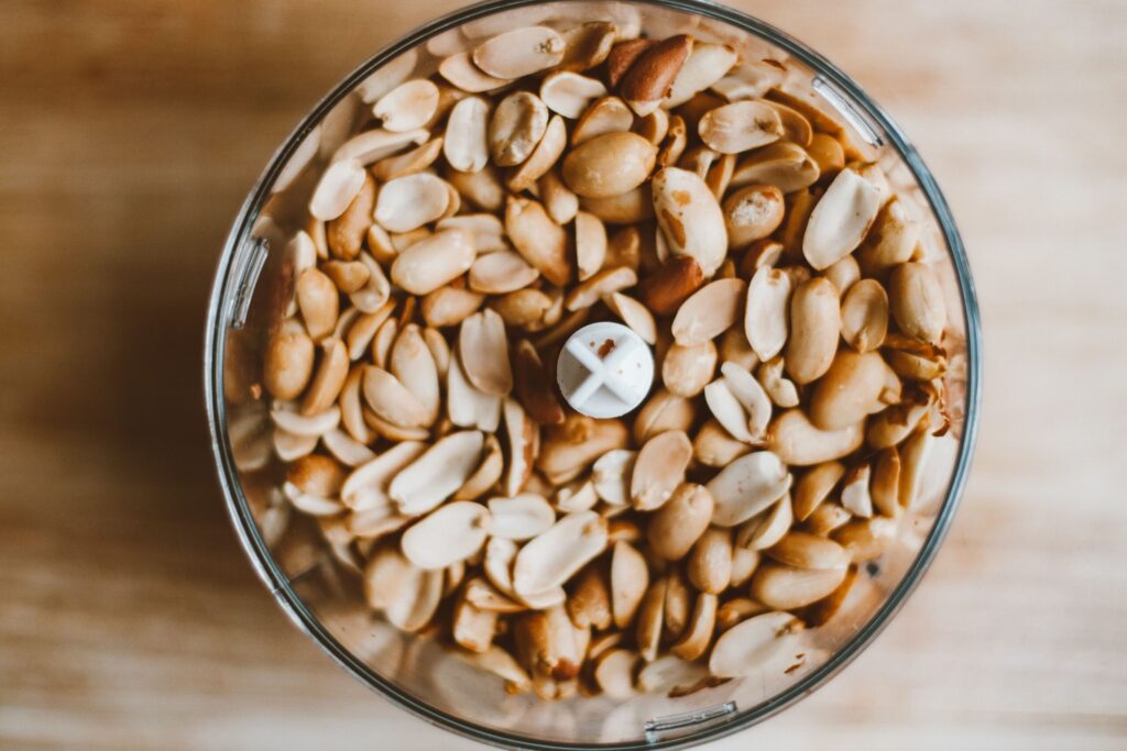 Peanuts in a food processor bowl