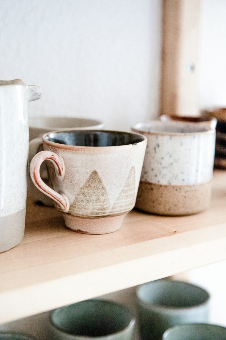 Two white ceramic mugs on a table