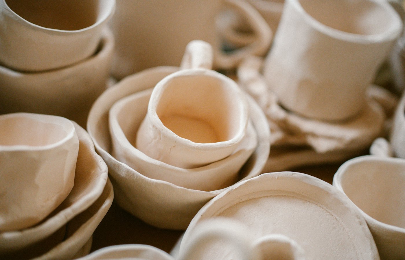 A stack of white plates on a table