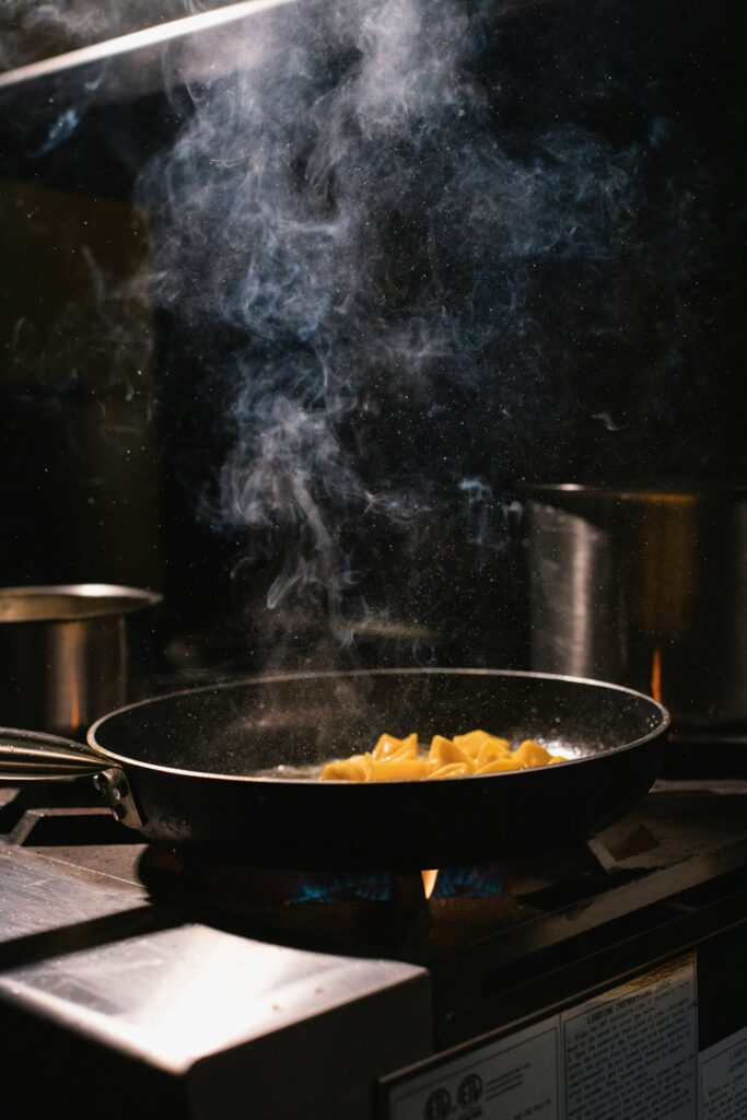 A black frying pan on a stovetop