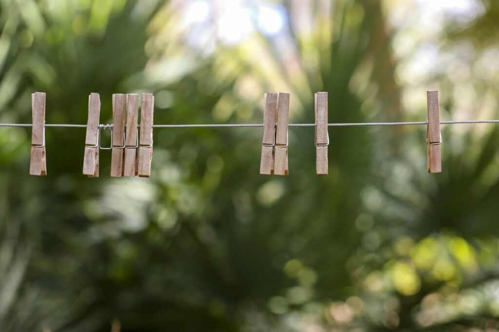Wooden clothes pins on a line