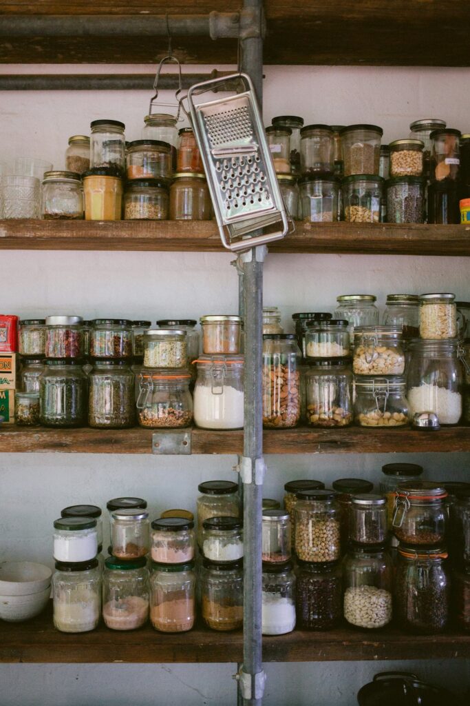 Glass jars on a wooden shelf