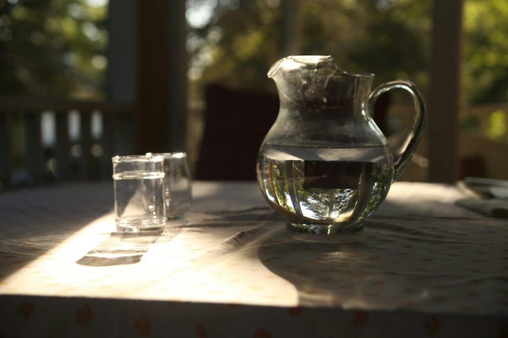 A glass pitcher of water
