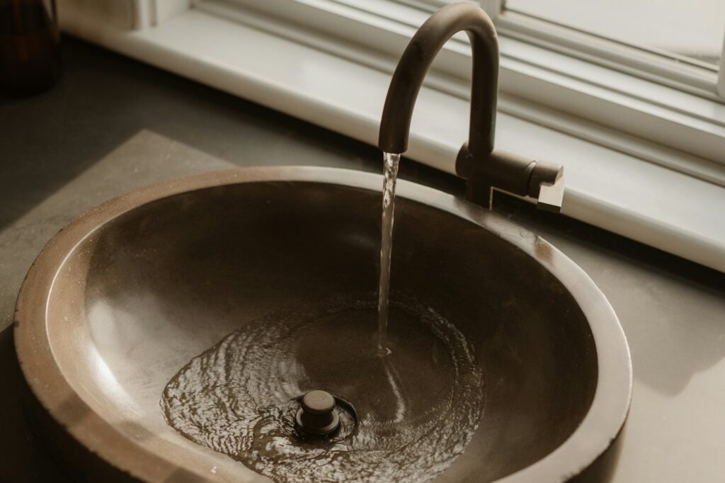Water running from a kitchen faucet