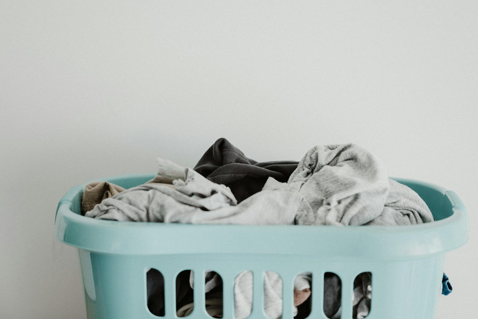 White linens in a laundry basket