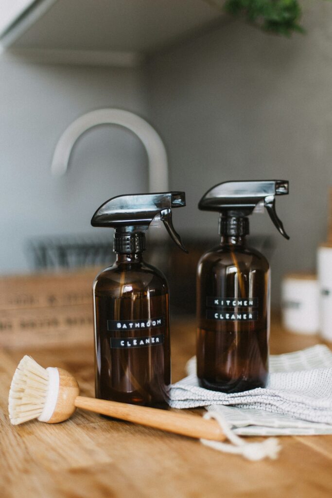 Two brown spray bottles on a table for simple cleaning