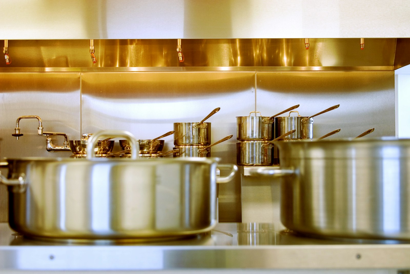 Stainless steel cookware set in a home kitchen